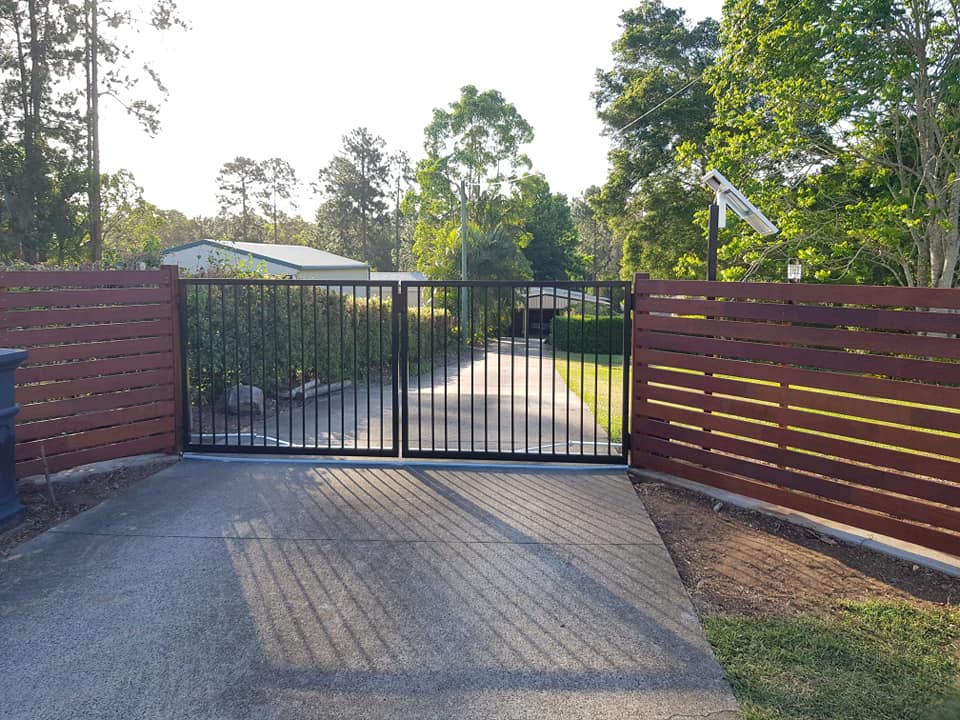 A steel gate on a residential driveway